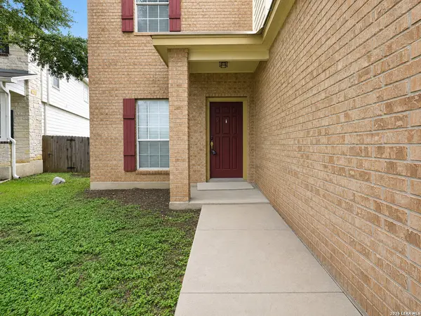 Covered front entry of 3826 Otono with a red front door